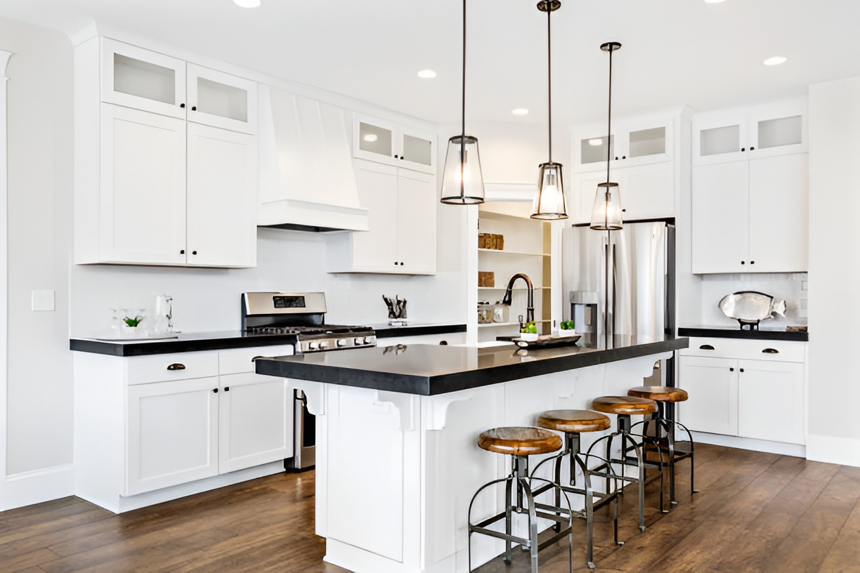modern black and white kitchen with hardwood flooring
